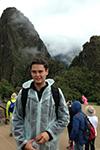 Juan Martin Davila Grijalva posing for a photo in front of Machu Picchu.