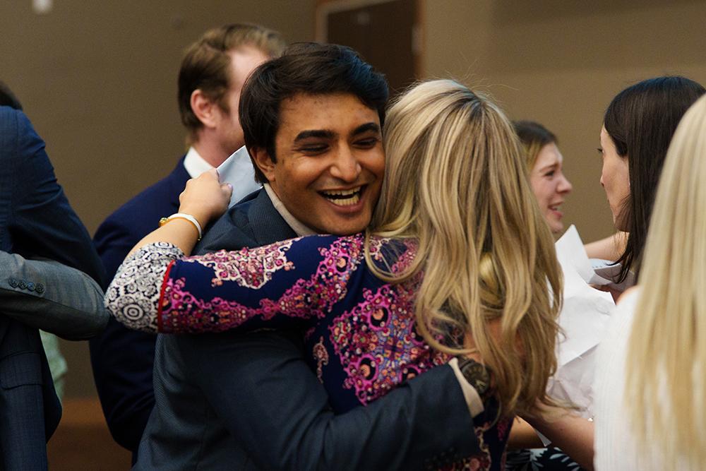 An image of Shivam Patel hugging someone at the Match Day event